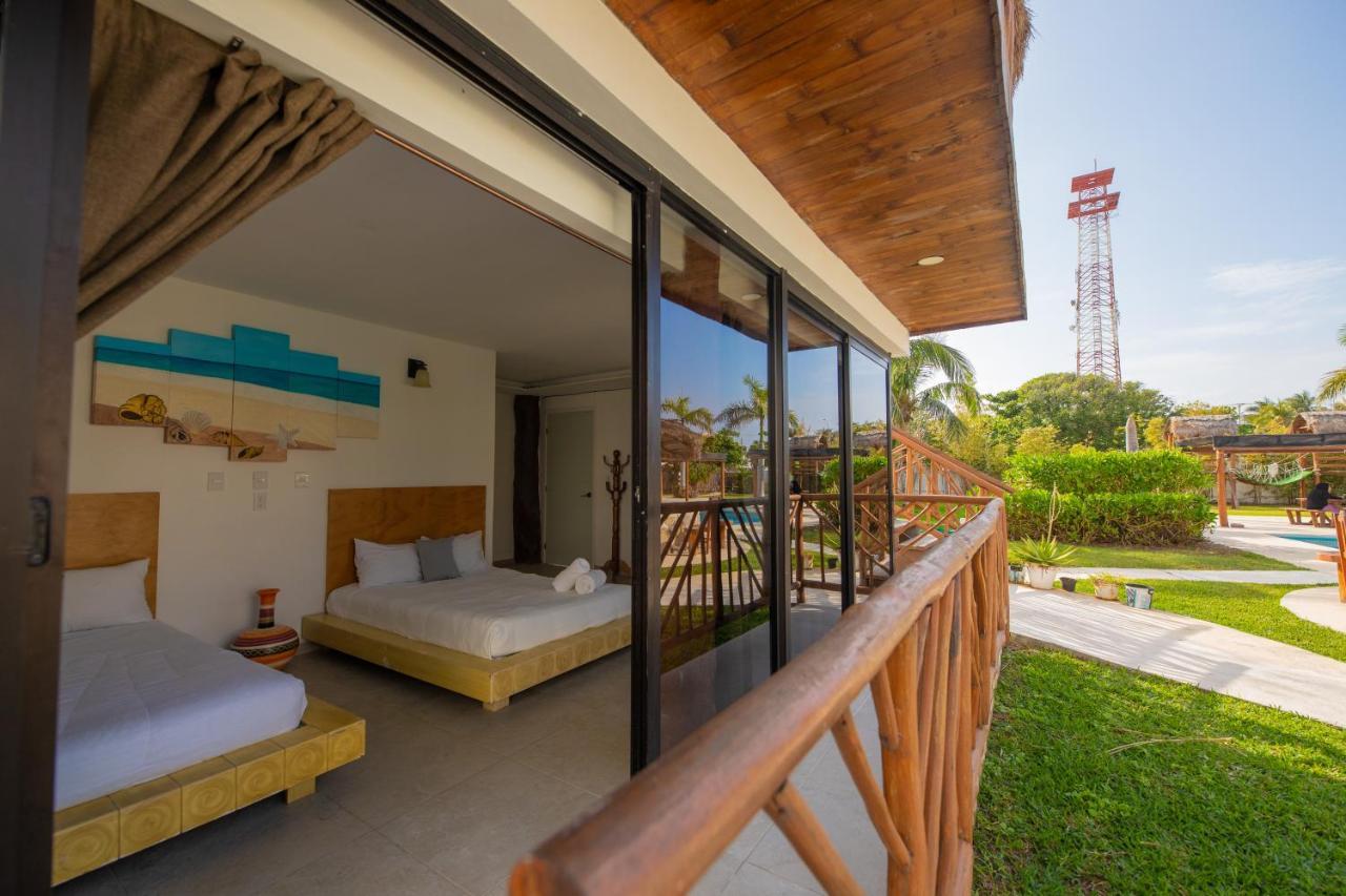 Hotel & Beach Club Ojo De Agua ปัวร์โตโมเรลอส ภายนอก รูปภาพ