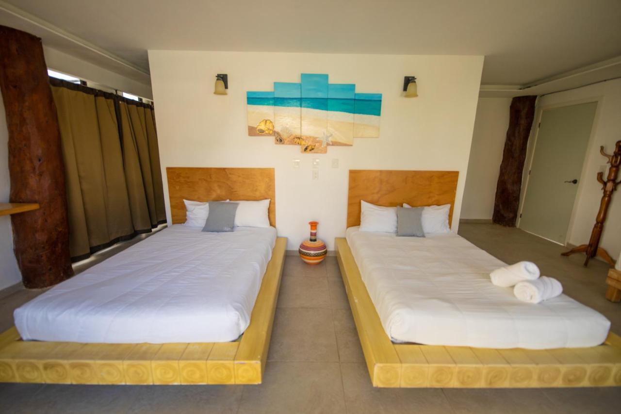Hotel & Beach Club Ojo De Agua ปัวร์โตโมเรลอส ภายนอก รูปภาพ